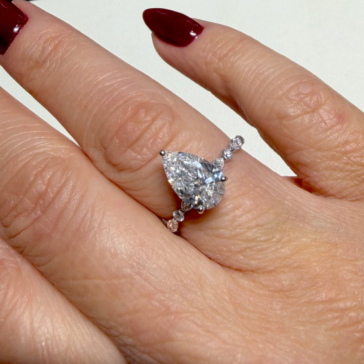 2.03 CT PEAR WITH SIDE STONES